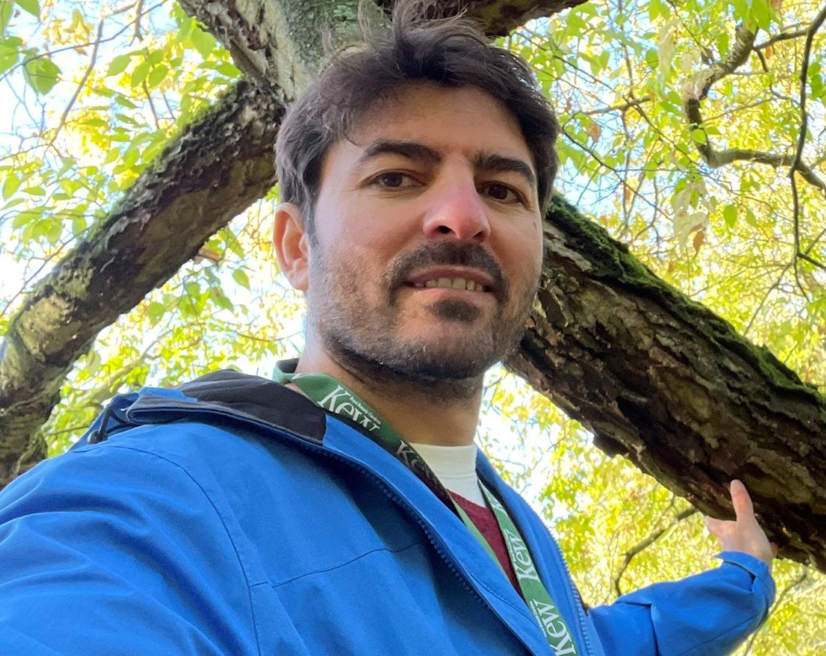 Mohammad Vatanparast, Postdoctoral Researcher standing in front of a tree